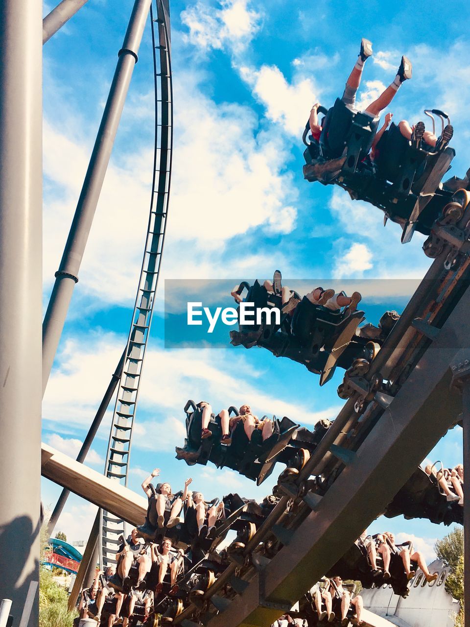 LOW ANGLE VIEW OF ROLLERCOASTER AGAINST SKY