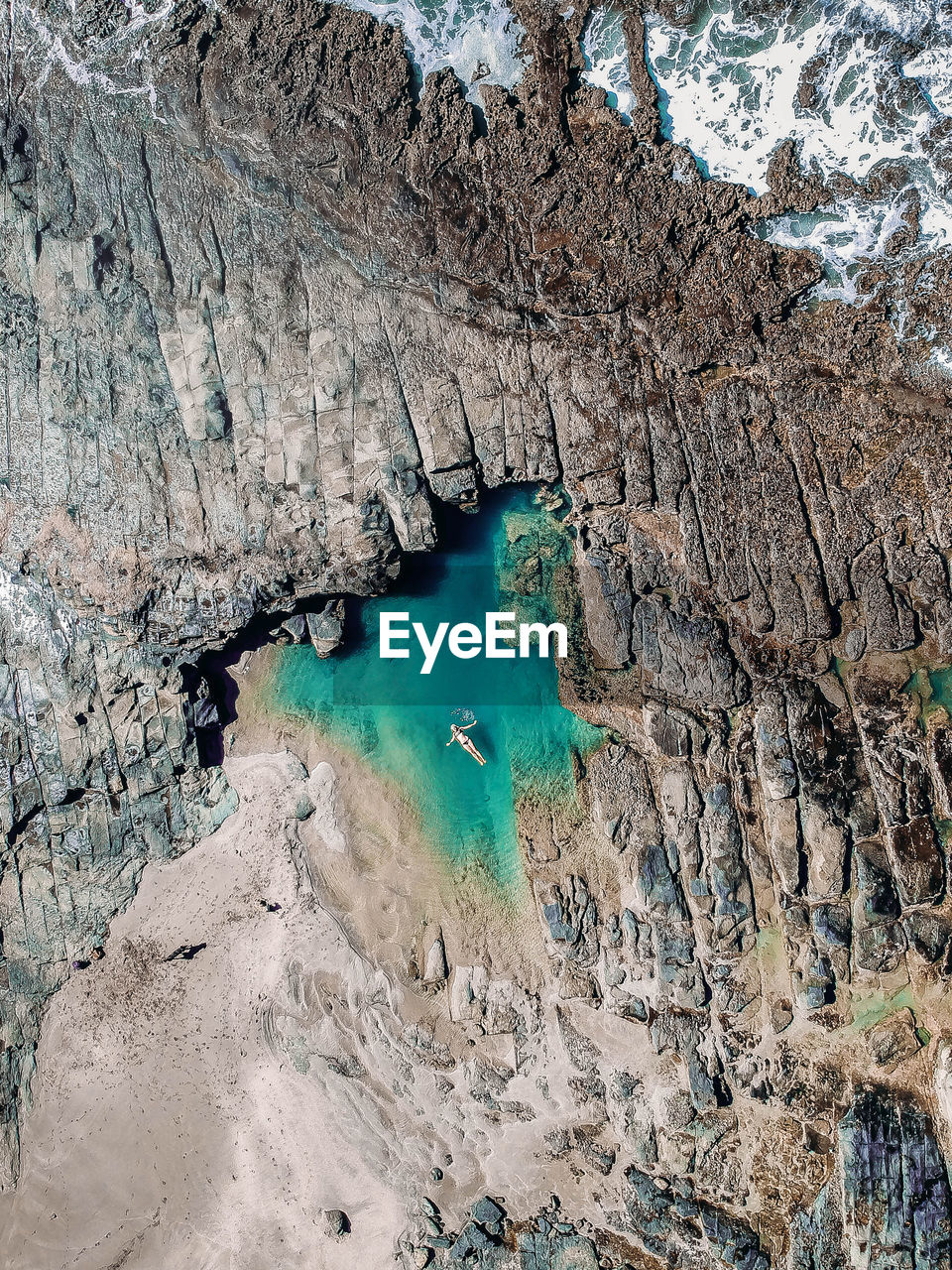 High angle view of rock formations in water