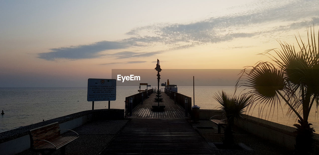 Wooden pier in protaras in cyprus at sunrise