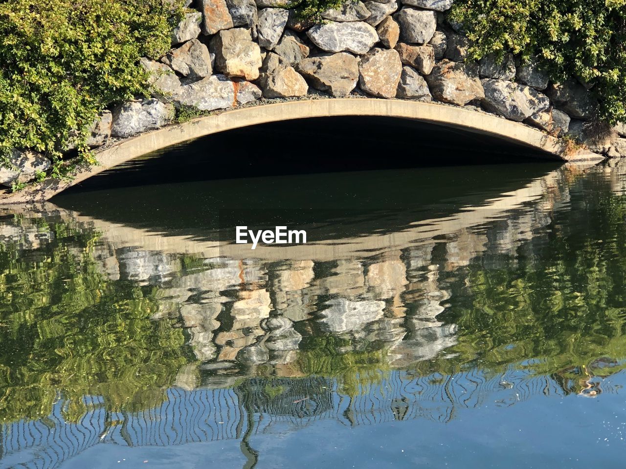 Arch bridge over lake