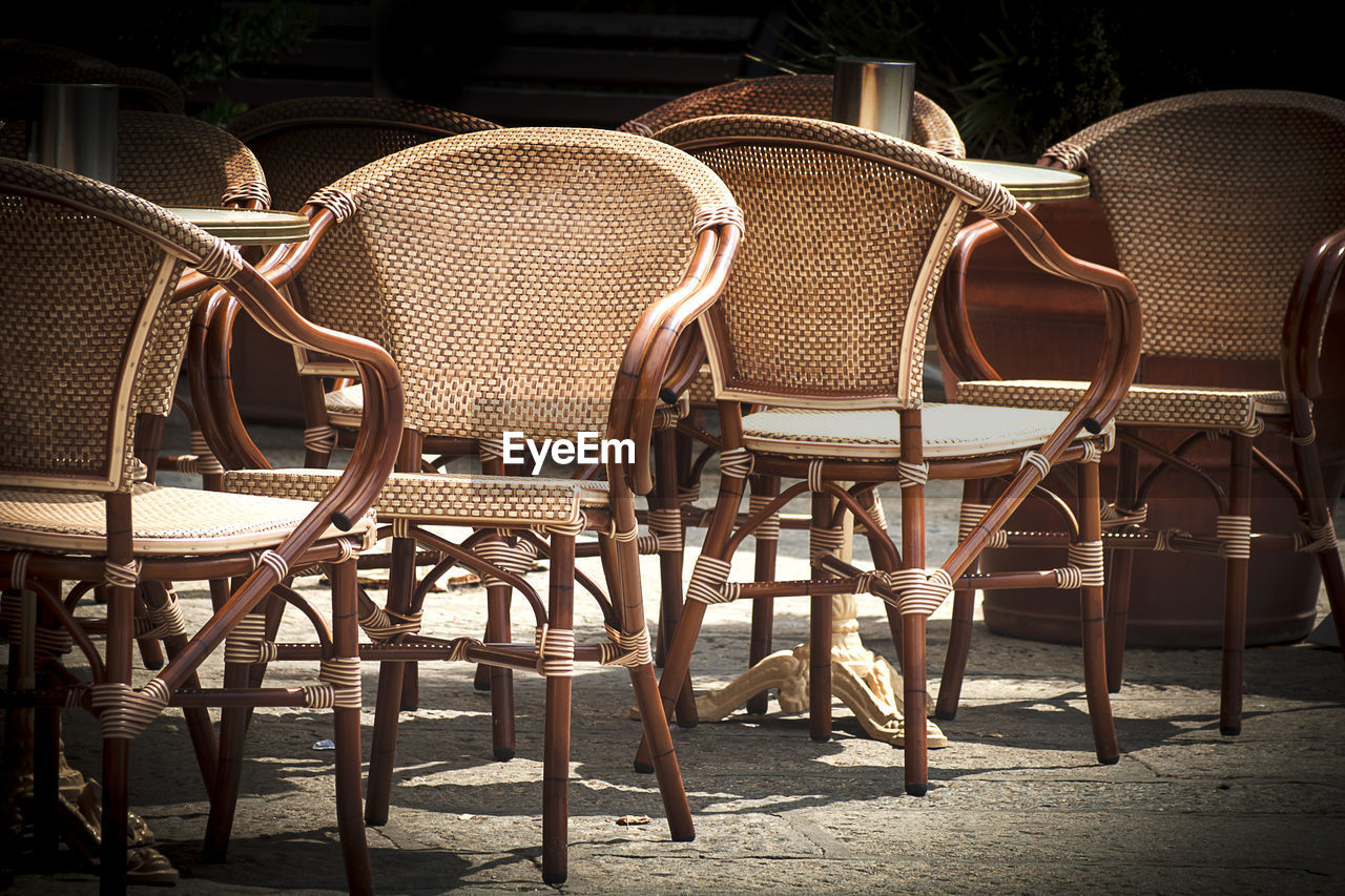 EMPTY CHAIRS AND TABLE ON TABLES