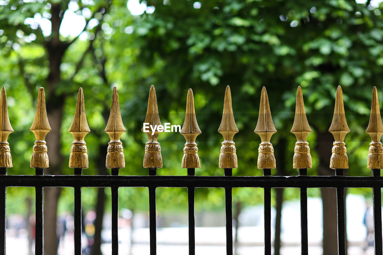 Metallic fence against trees