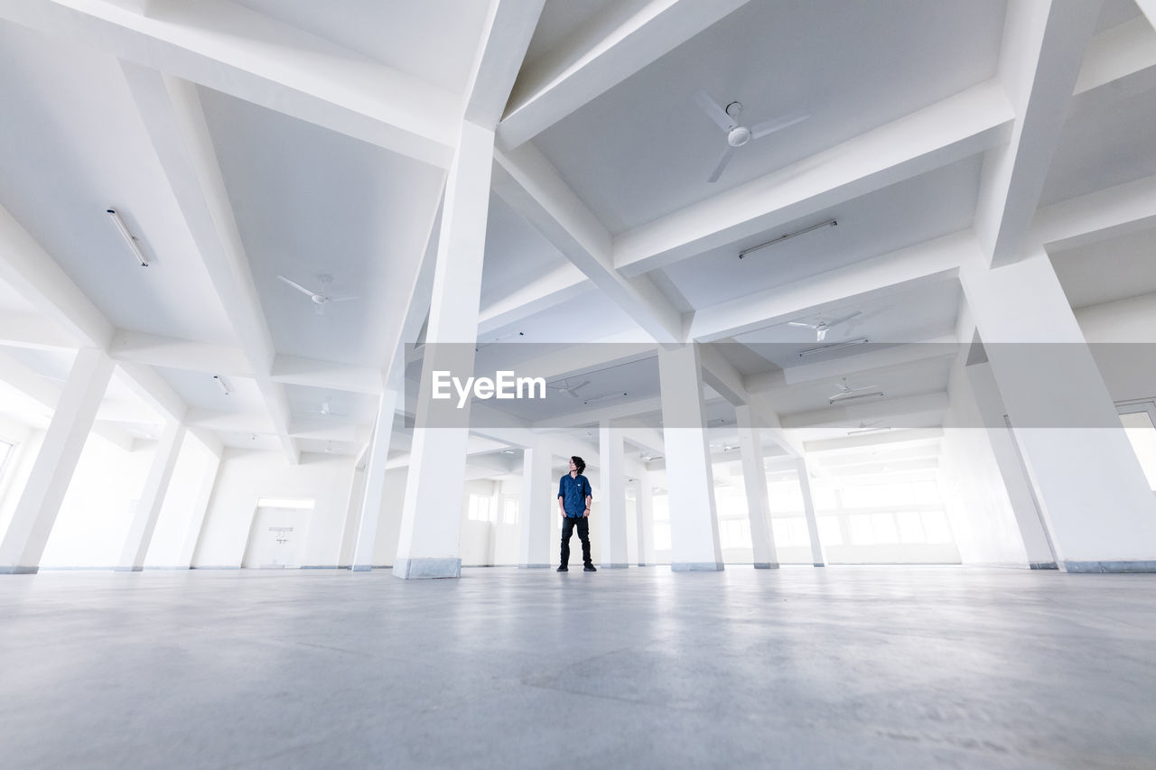 Man standing in empty building