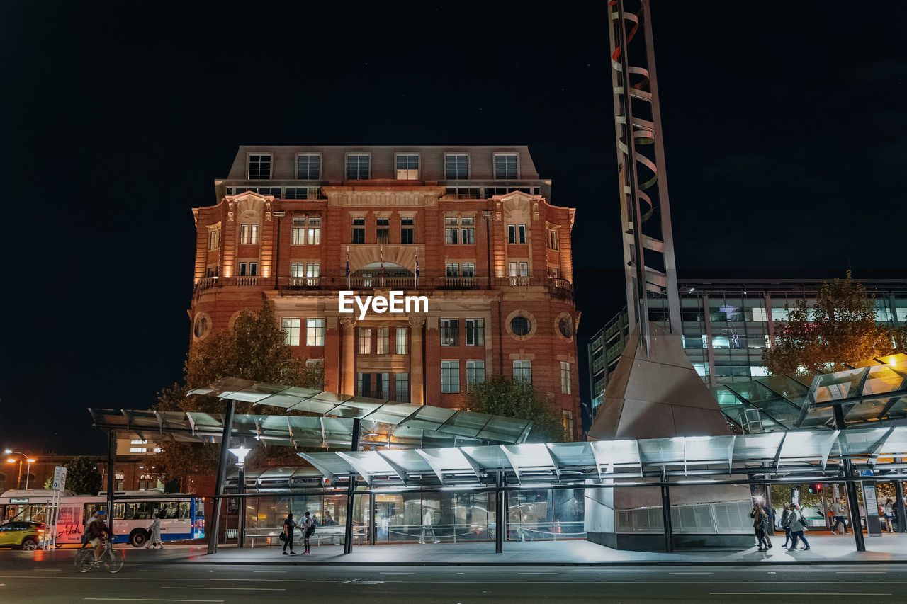 Buildings in city at night