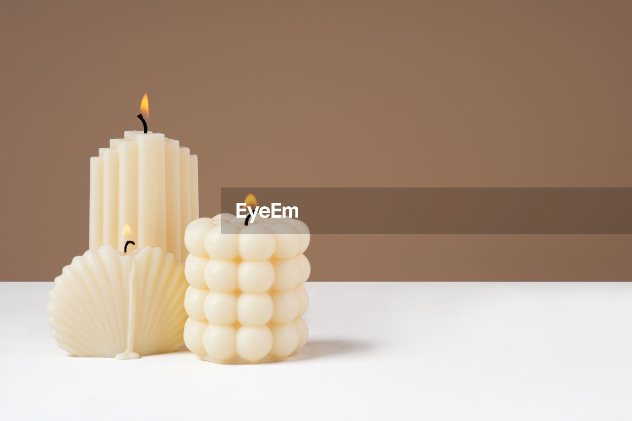 Olive wax burning candle. sustainability vegan candle. minimalistic. copy space. banner