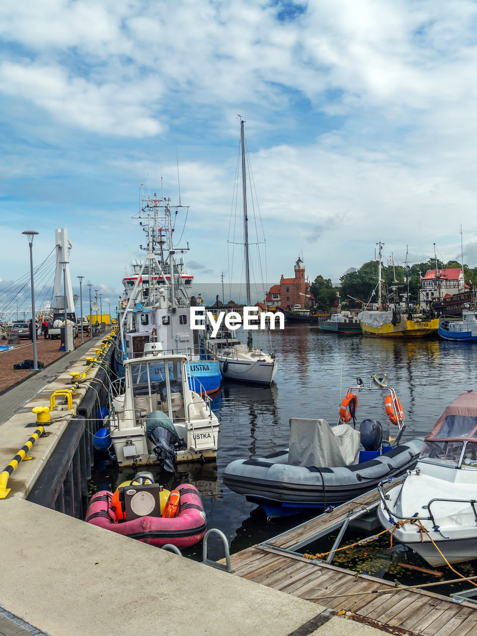 BOATS MOORED IN HARBOR