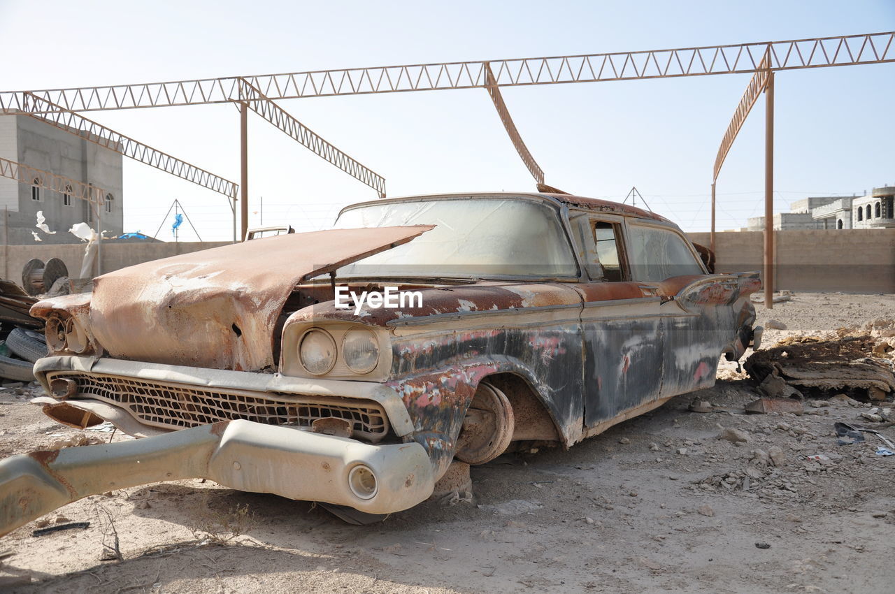 ABANDONED CAR ON RUSTY TRUCK