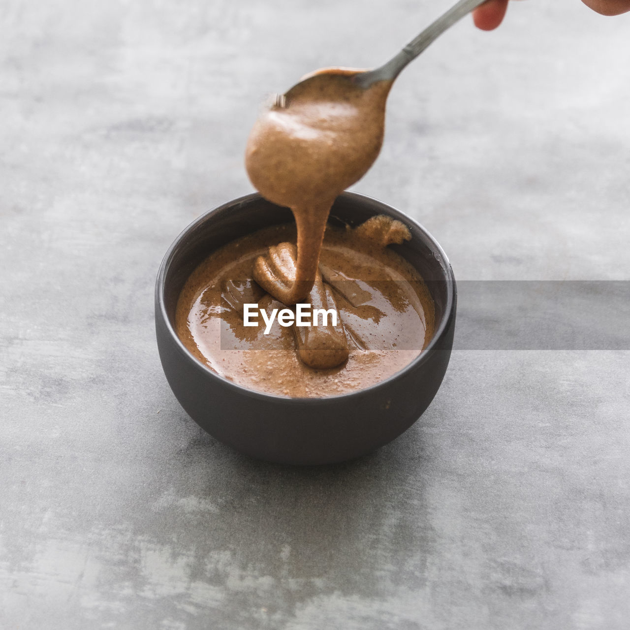 Close-up of peanut butter sauce satay in bowl on table