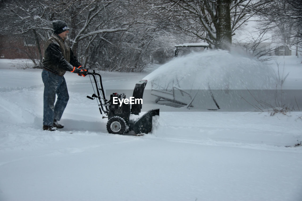 Man with snowblower