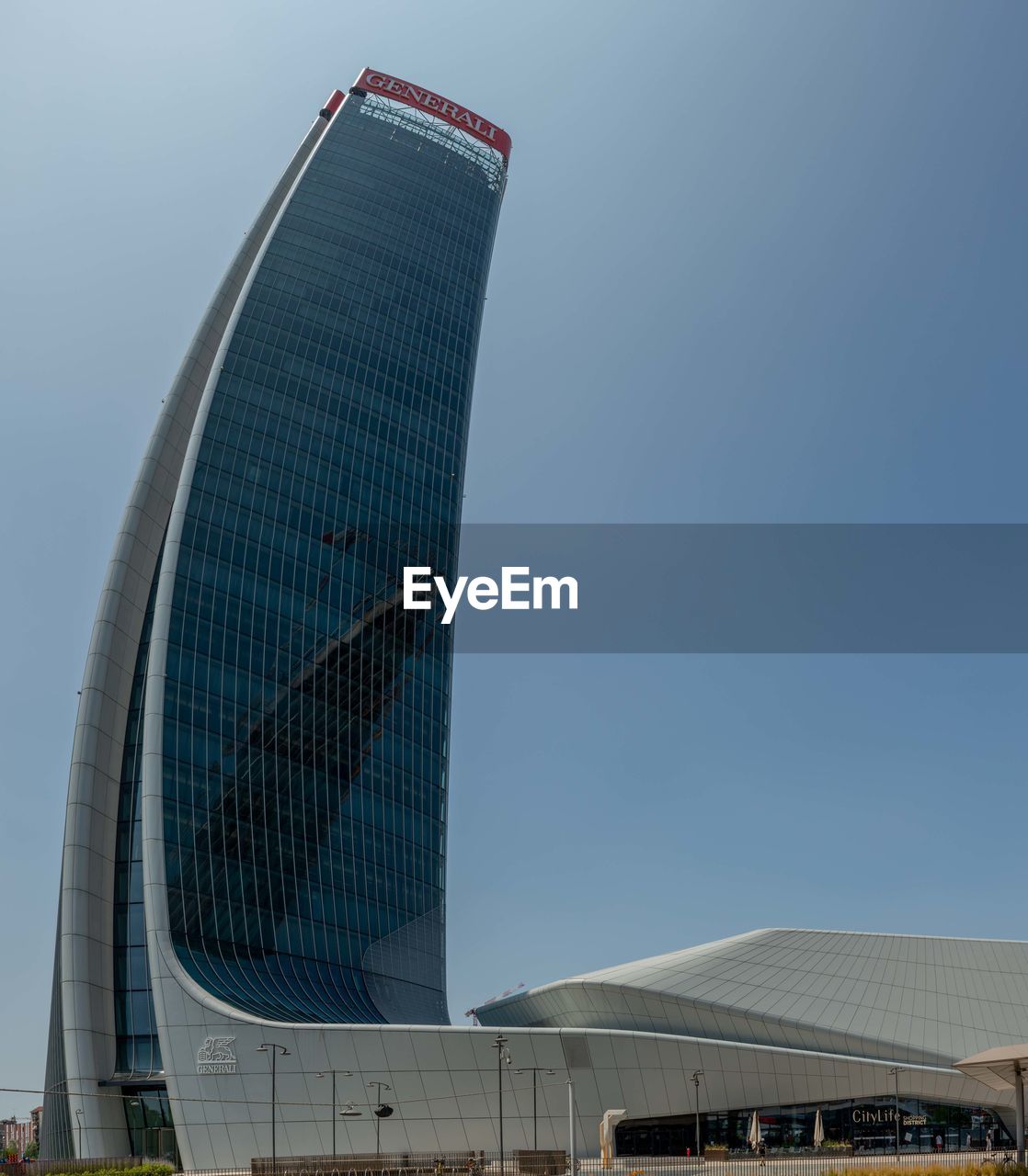 LOW ANGLE VIEW OF MODERN BUILDINGS AGAINST CLEAR BLUE SKY