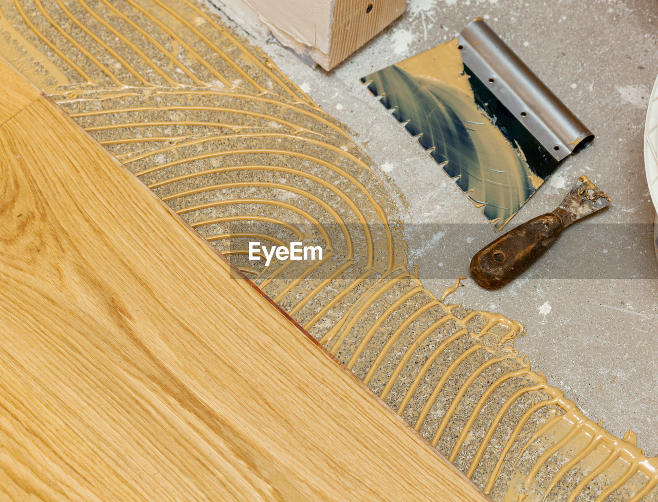 high angle view of work tools on wooden table