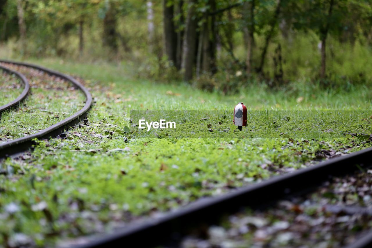 View of person walking on railroad track