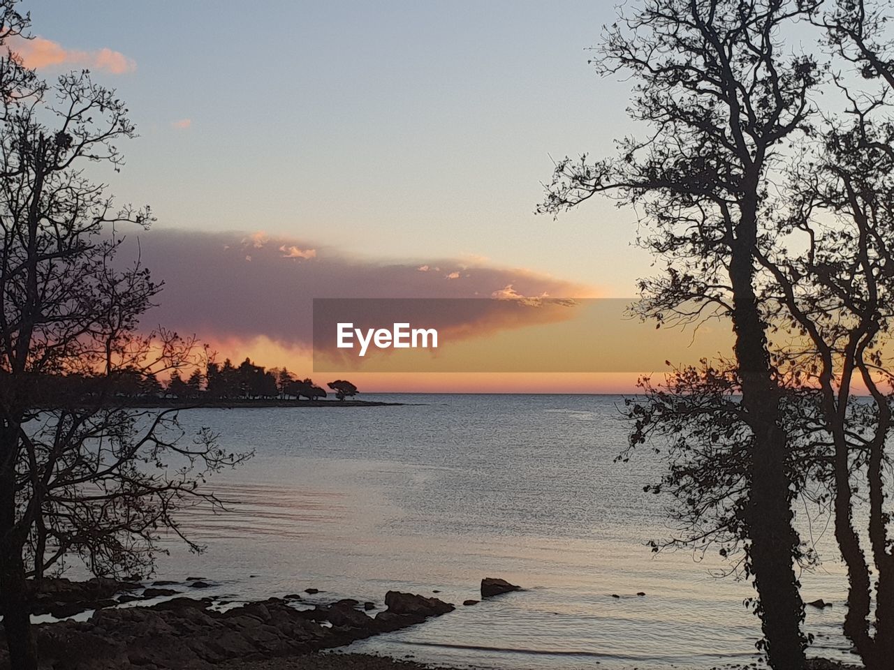 SCENIC VIEW OF SEA DURING SUNSET