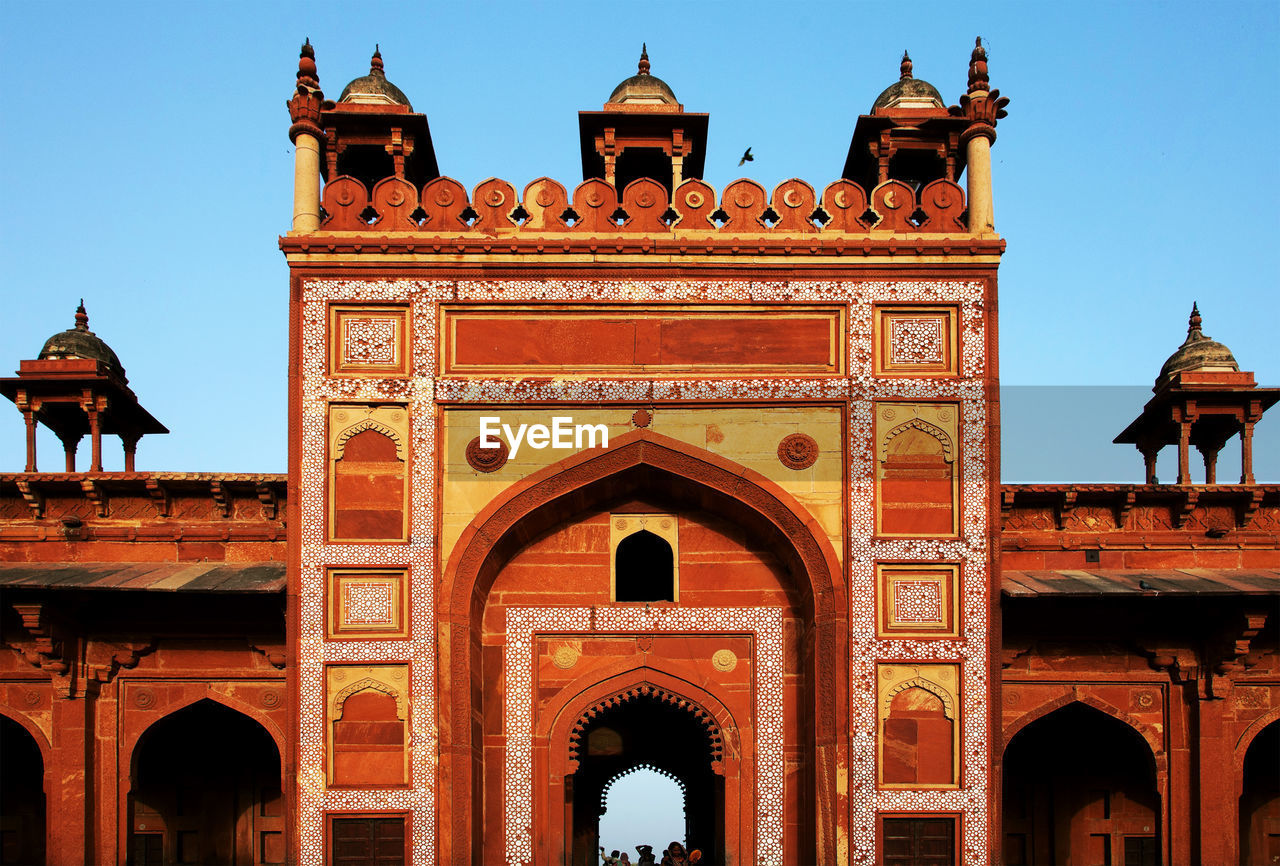 Facade of agra fort against clear sky