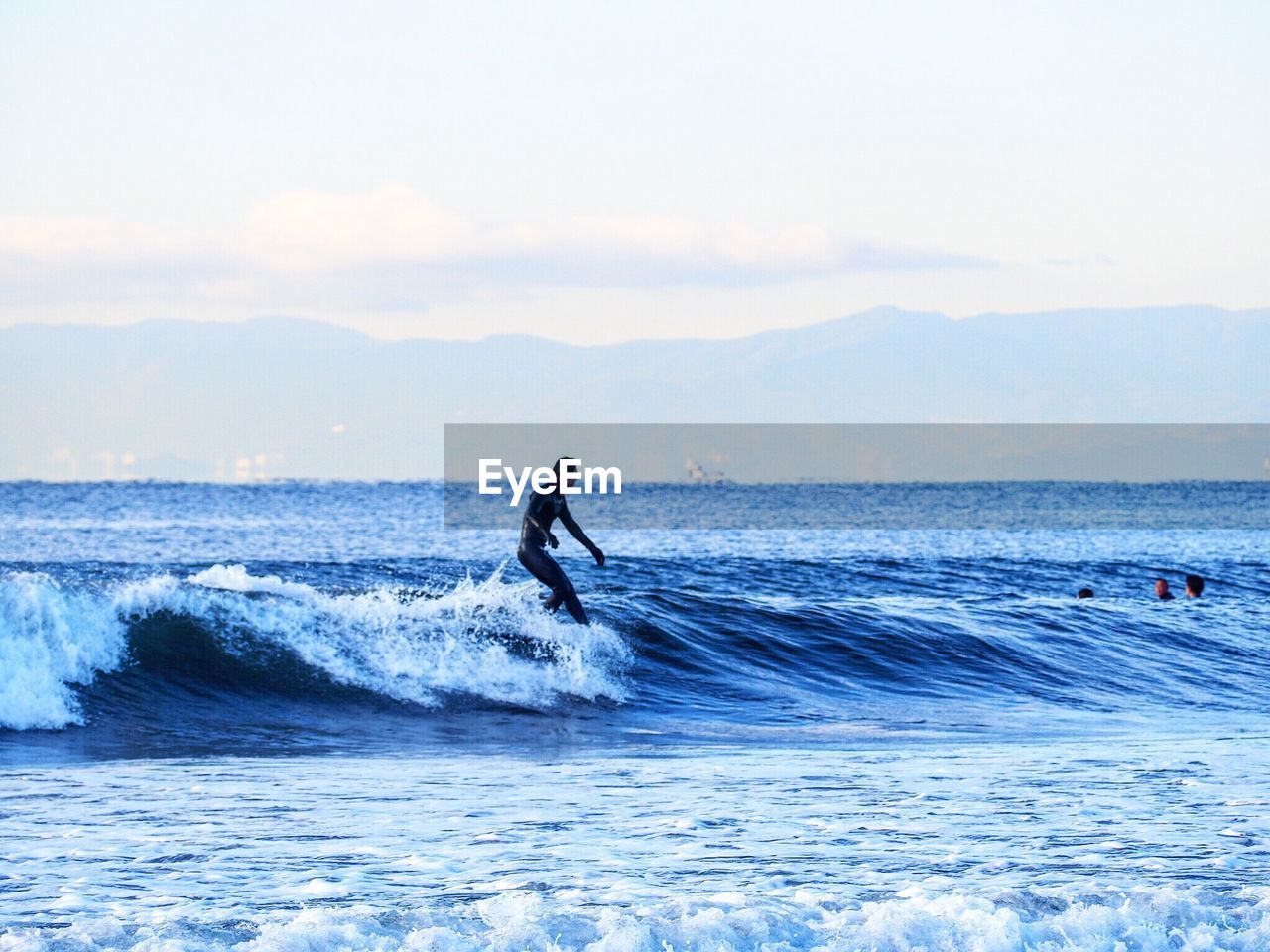 MAN SURFING IN SEA