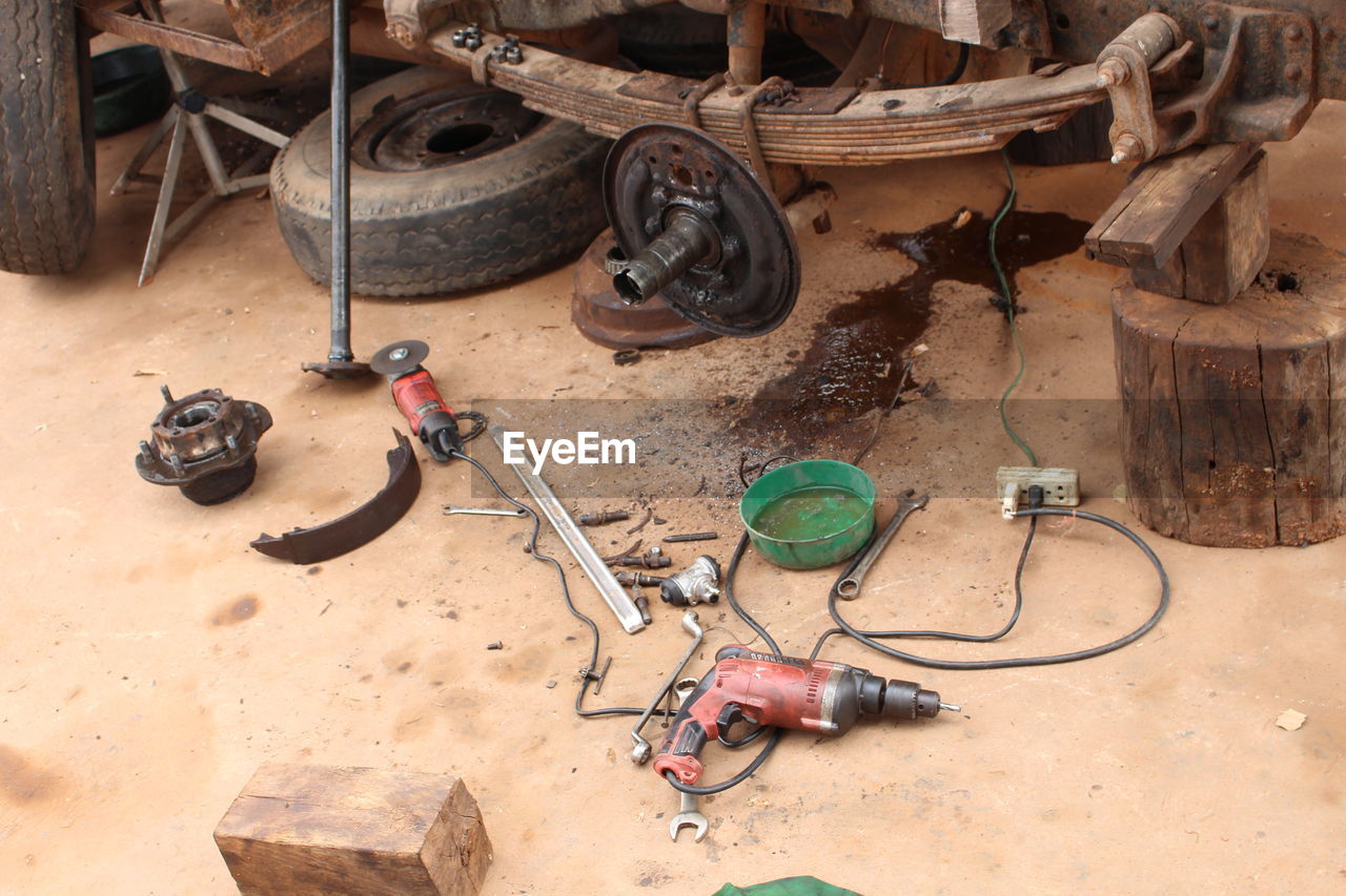 High angle view of work tools on land in garage