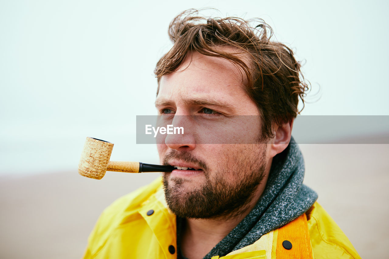 Man smoking at beach