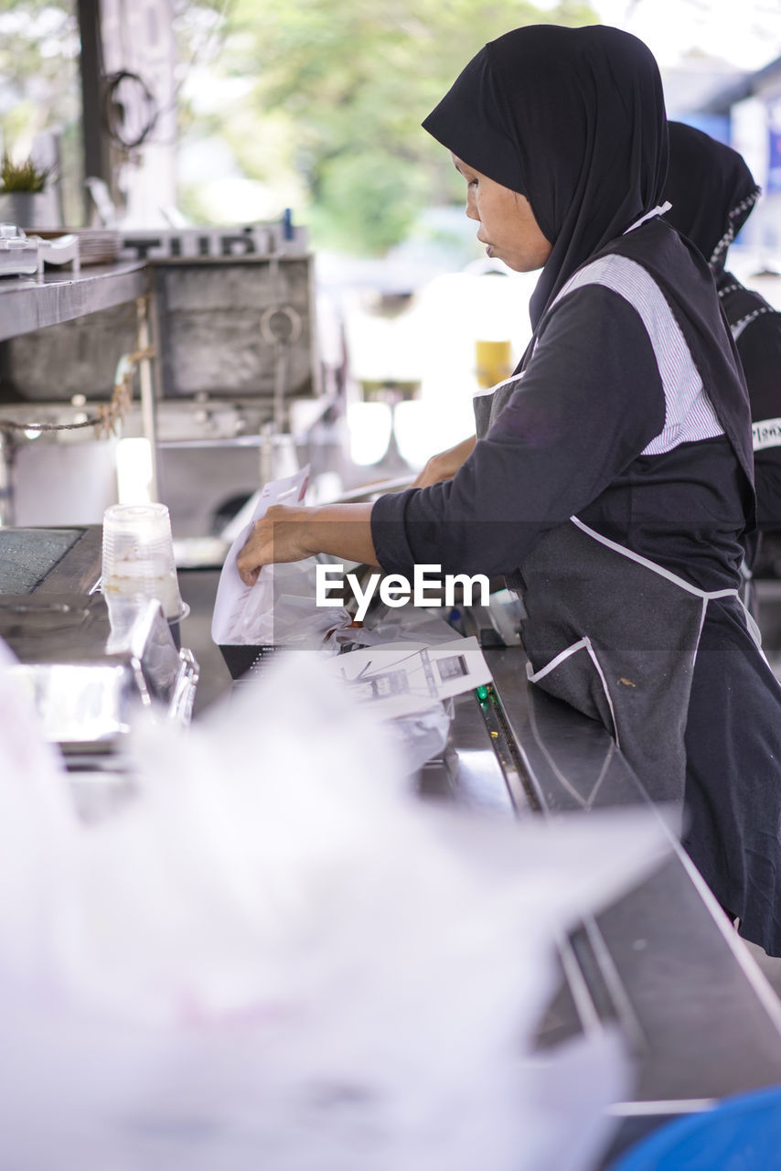 Woman preparing food at hotel