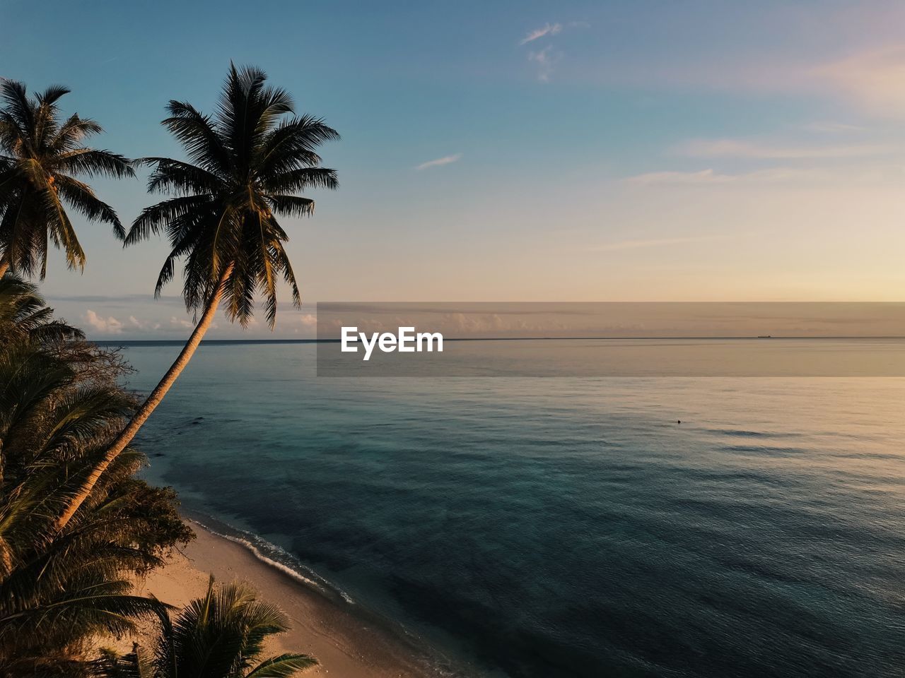 scenic view of sea against sky at sunset