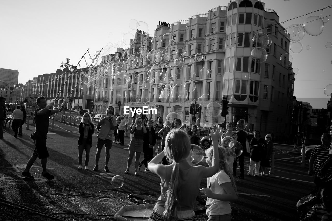 PEOPLE WALKING IN CITY