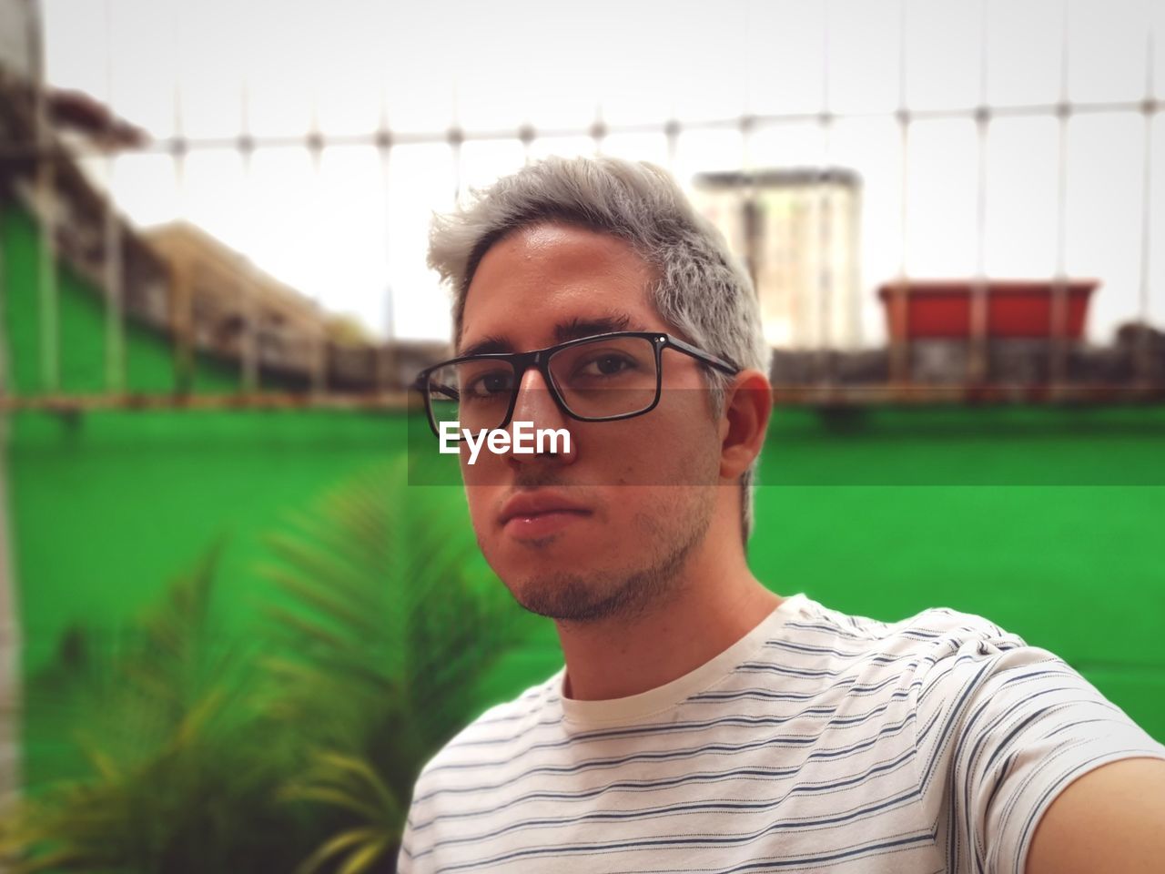 Portrait of young man wearing eyeglasses