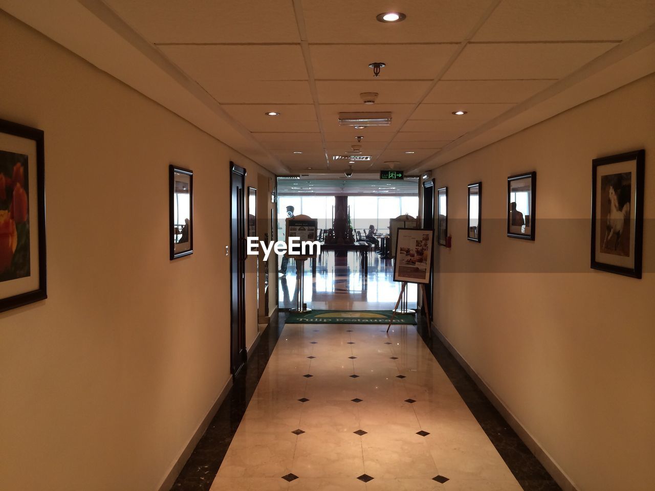 LONG EMPTY CORRIDOR ALONG PILLARS