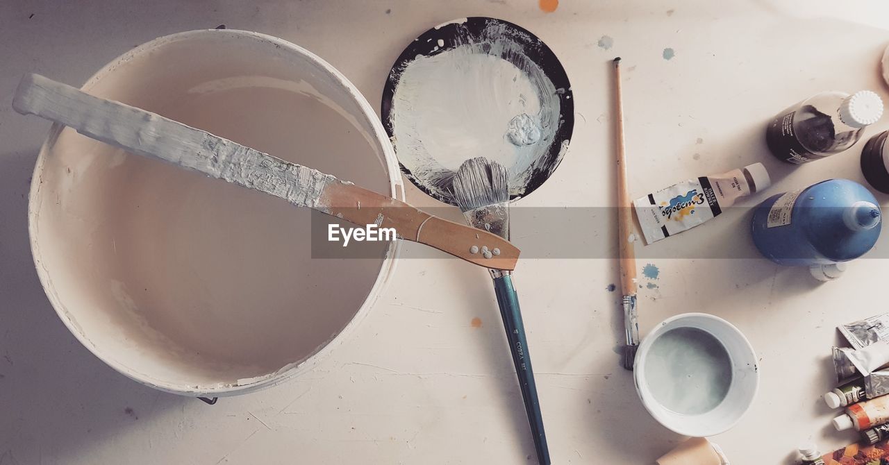 HIGH ANGLE VIEW OF PAINT ON TABLE