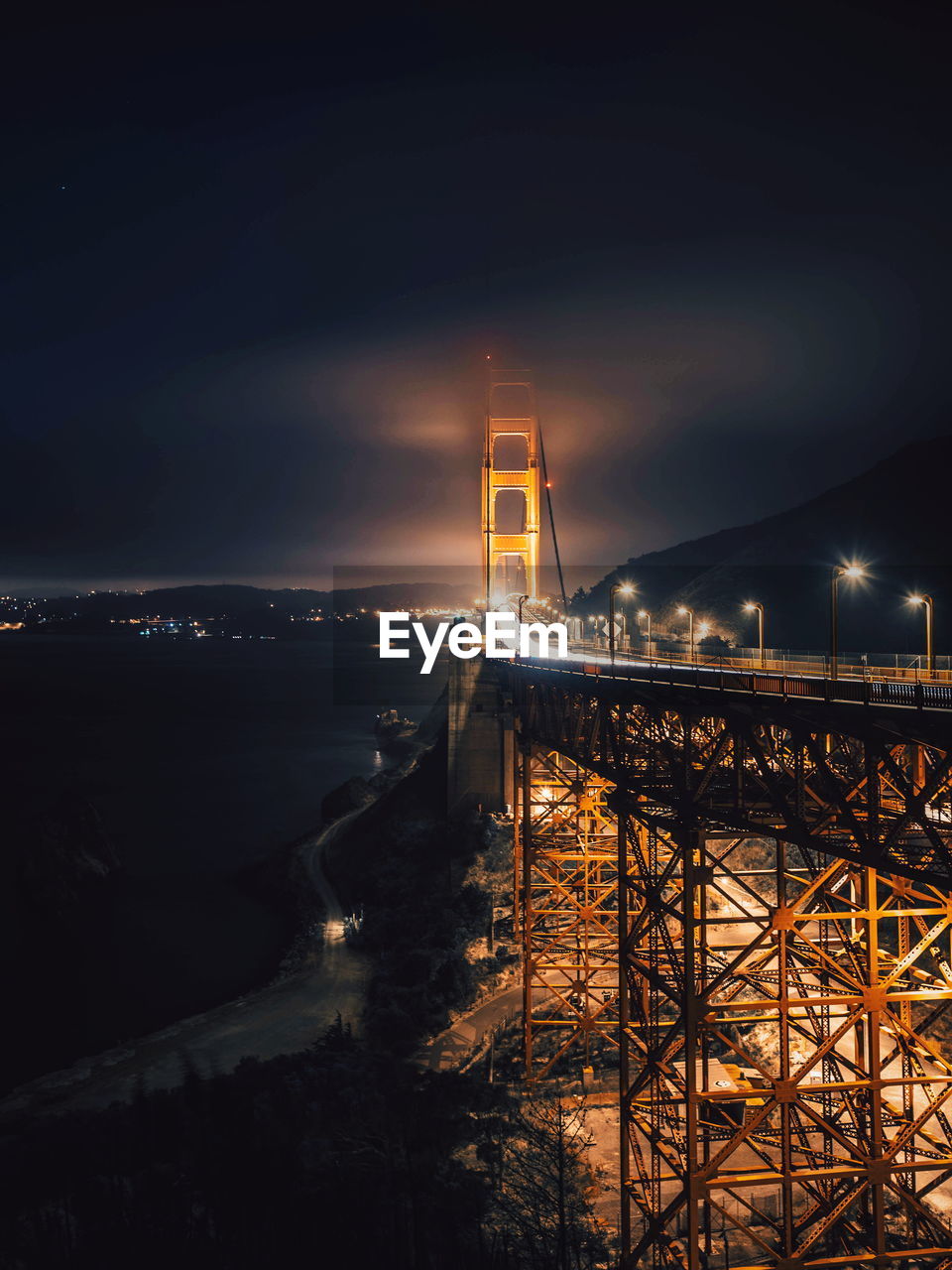 Illuminated suspension bridge at night