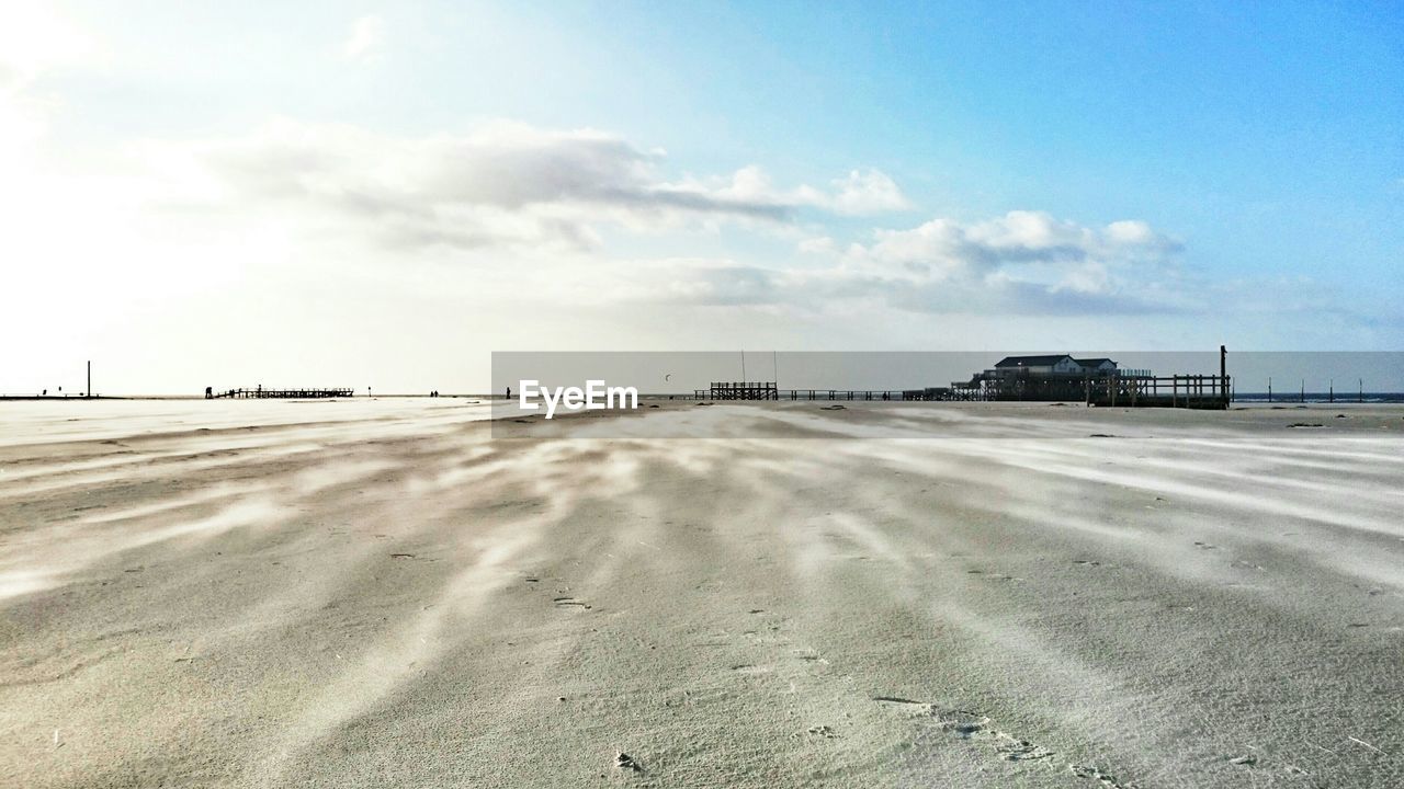 VIEW OF TIRE TRACKS ON BEACH