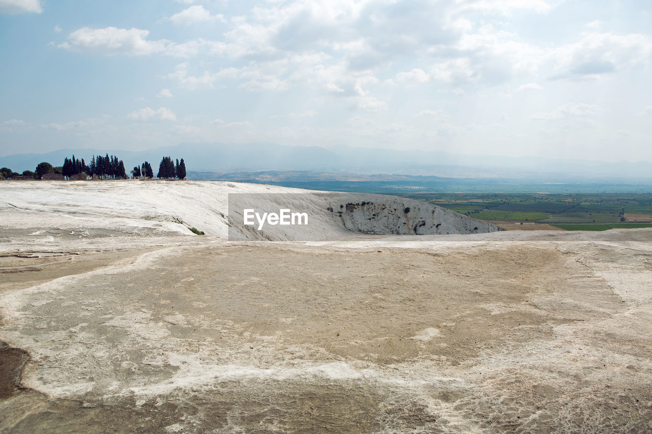 White calcium mountain with granite with small waterfall in summer in pamukkale turkey