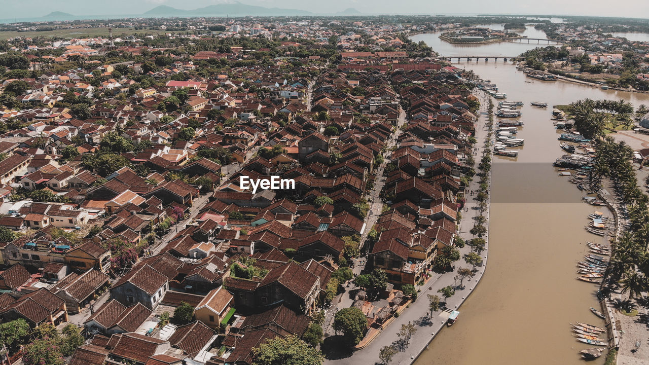 High angle view of river amidst buildings in town