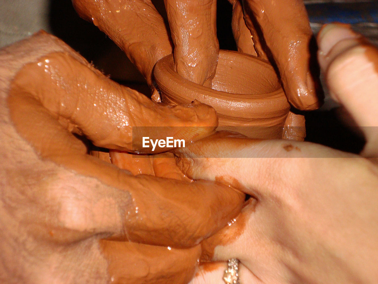 MIDSECTION OF PERSON WORKING WITH CHOCOLATE