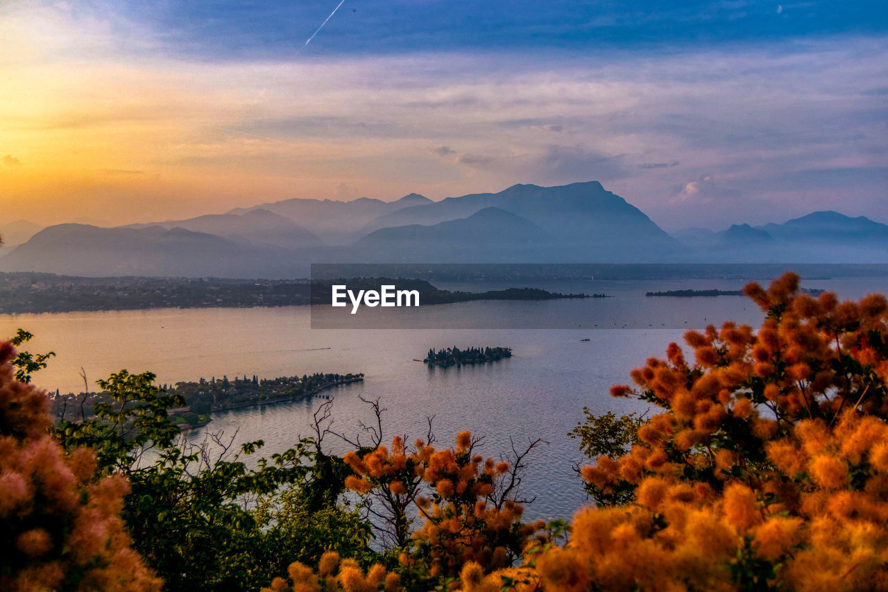 Scenic view of lake against sky during sunset