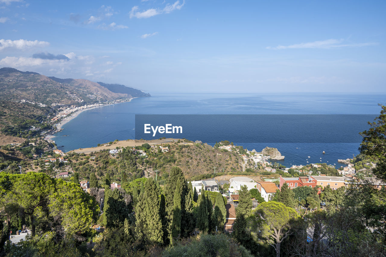 Aerial wide angle view of taormina and its beautiful coastline