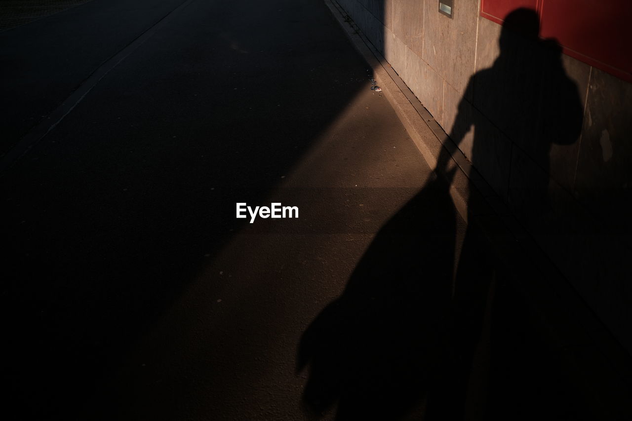 darkness, black, light, shadow, night, one person, silhouette, city, architecture, street, transportation, dark, walking, adult, men, road, lifestyles, standing, nature, sign, outdoors