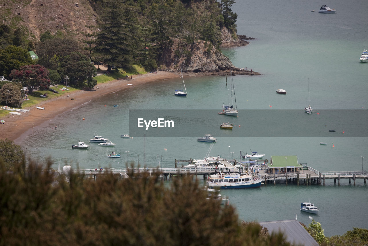 High angle view of boats moored at harbor