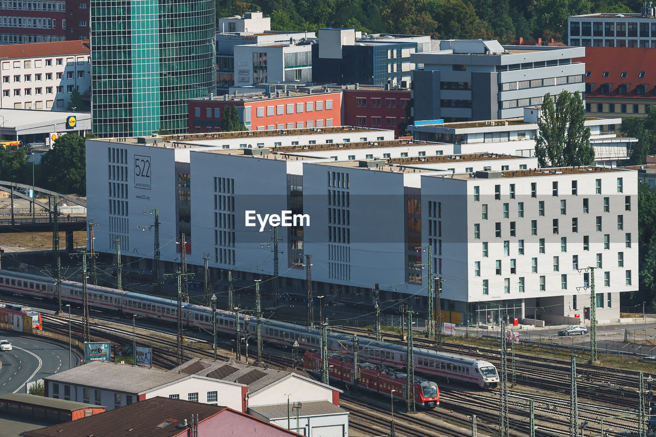 High angle view of railroad tracks amidst buildings in city