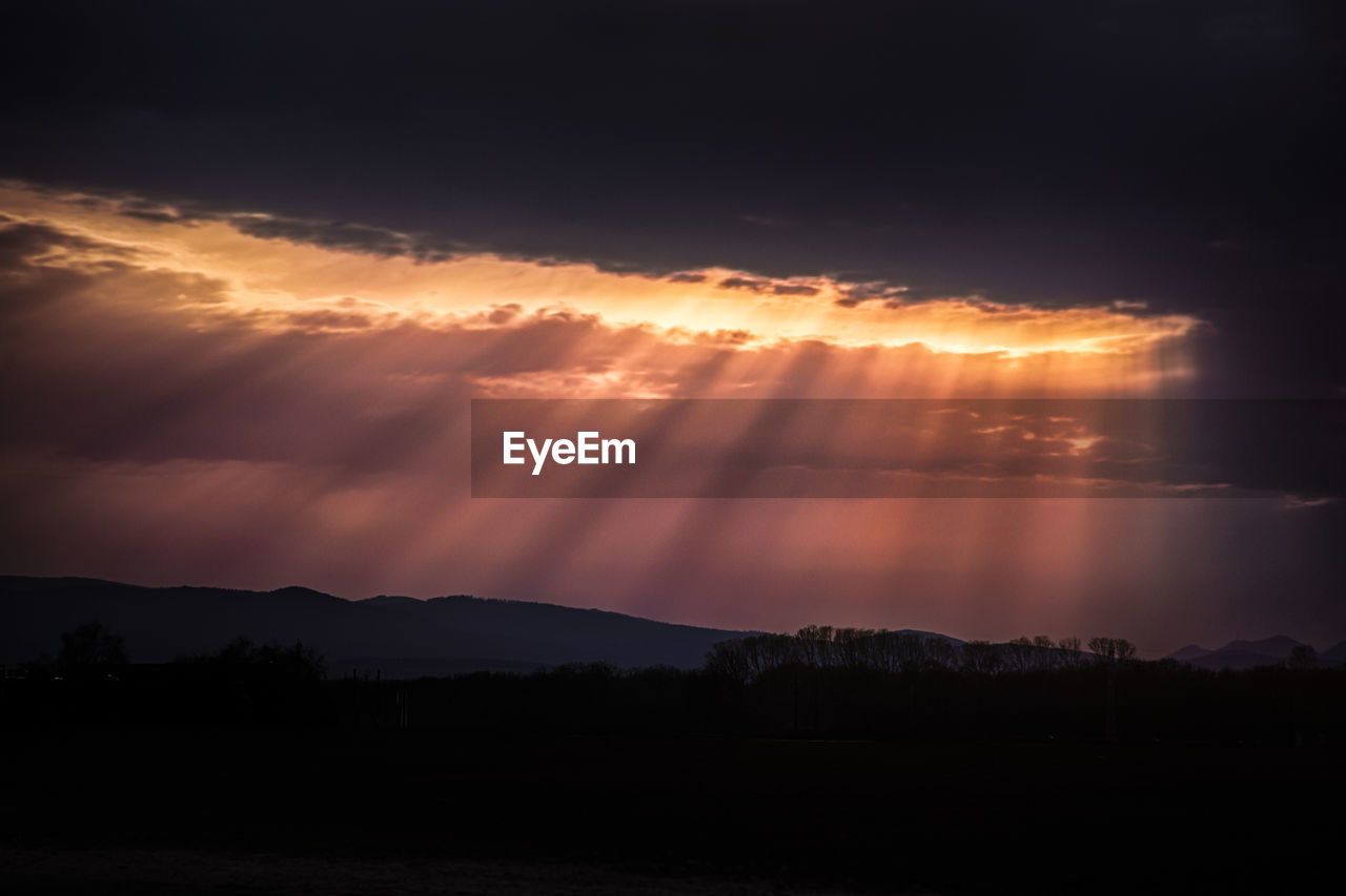 Scenic view of silhouette landscape against sky during sunset