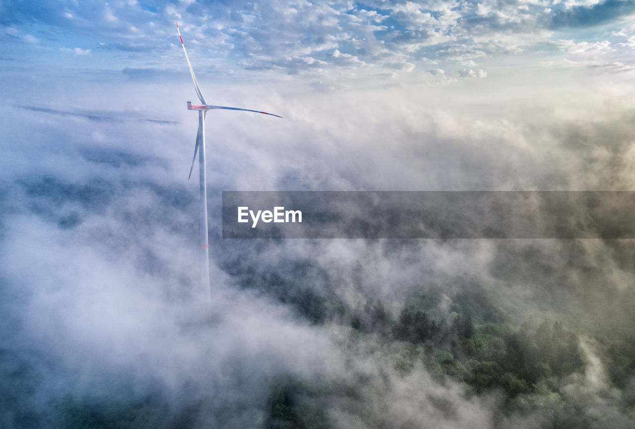 Germany, baden-wuerttemberg, schurwald, aerial view of wind wheel and morning fog