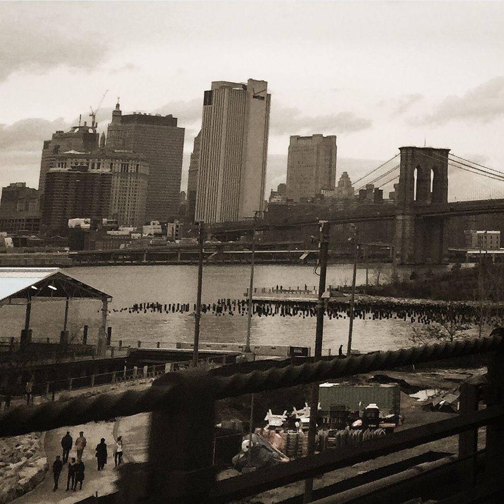 VIEW OF CITY AGAINST CLOUDY SKY