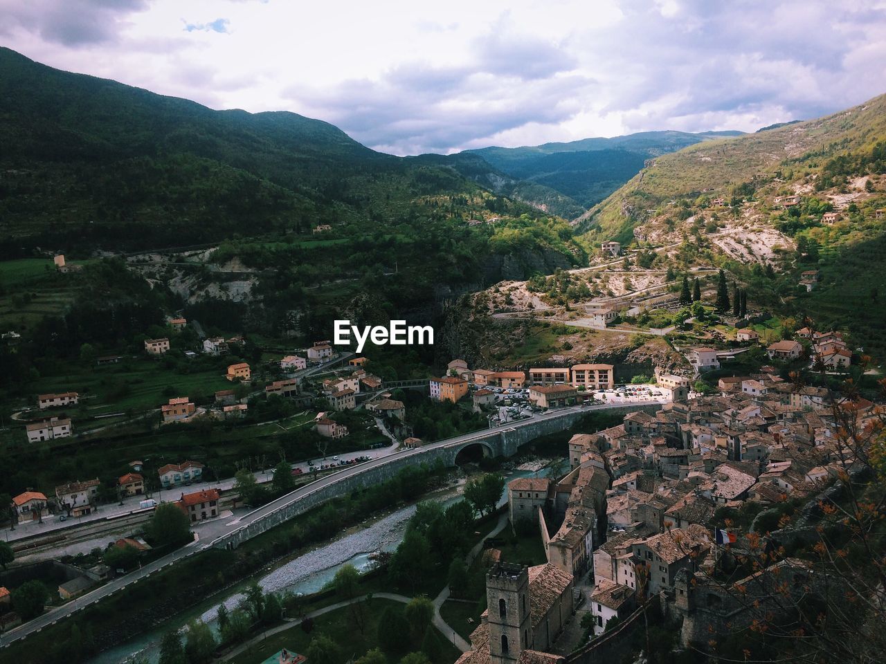 Scenic view of townscape and mountain