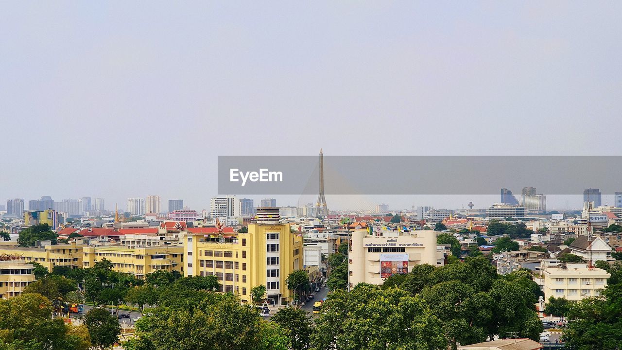 BUILDINGS AGAINST CLEAR SKY