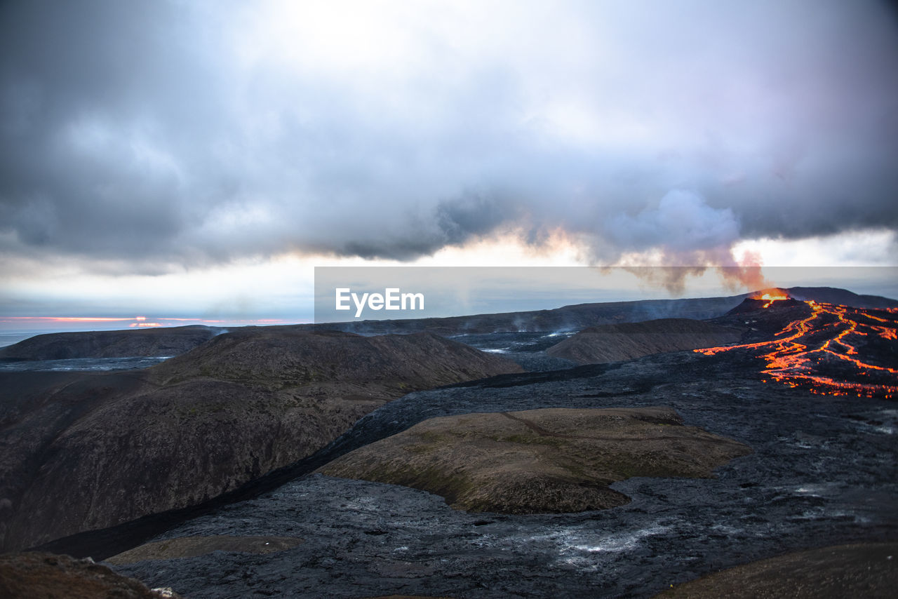 volcano, environment, geology, lava, landscape, mountain, nature, smoke, power in nature, land, erupting, cloud, heat, beauty in nature, sky, volcanic landscape, active volcano, warning sign, burning, no people, sign, non-urban scene, fire, accidents and disasters, scenics - nature, outdoors, communication, steam, volcanic crater, water, travel destinations, rock, motion, physical geography, flame, extreme terrain, travel, ash