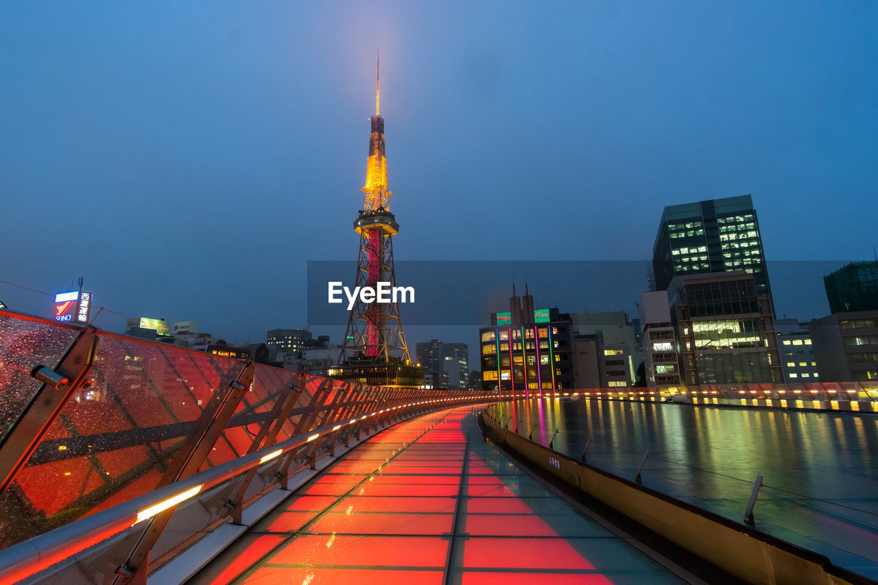 ILLUMINATED CITY BUILDINGS AT NIGHT