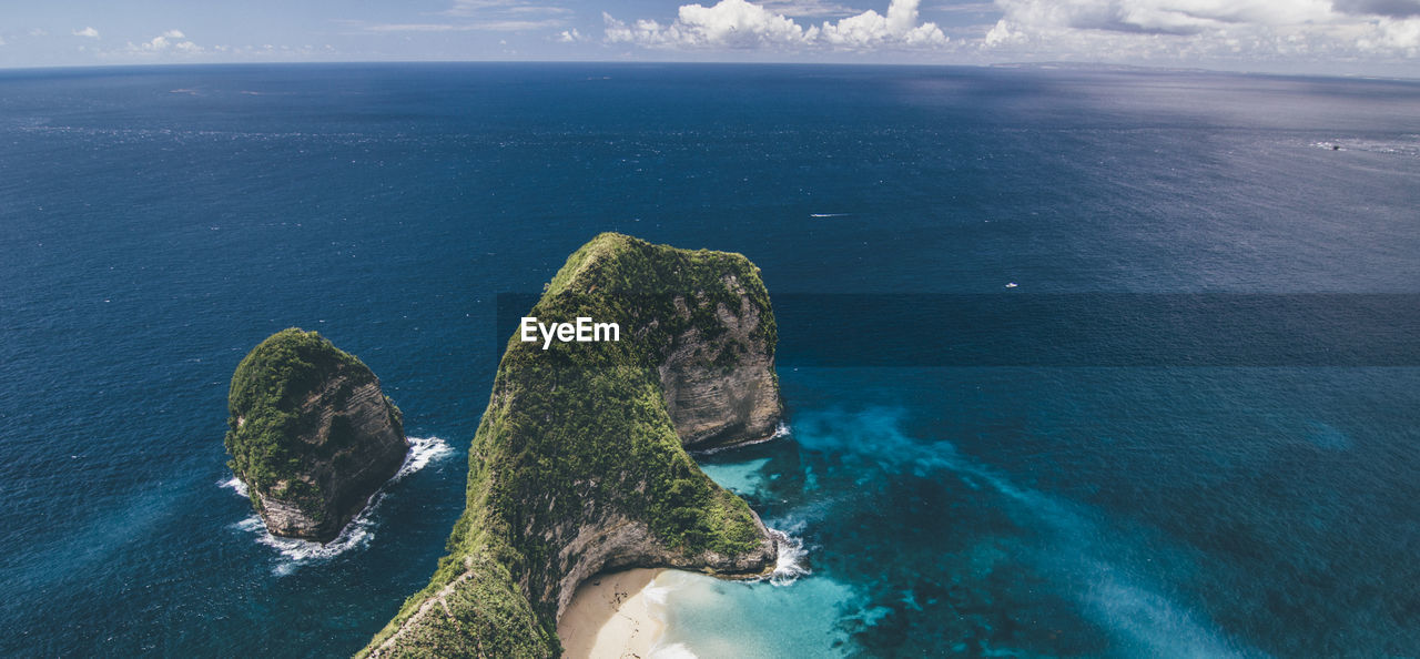 High angle view of sea against blue sky