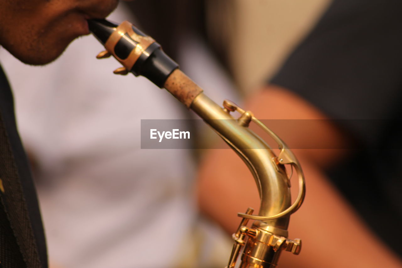 Close-up of man playing trumpet