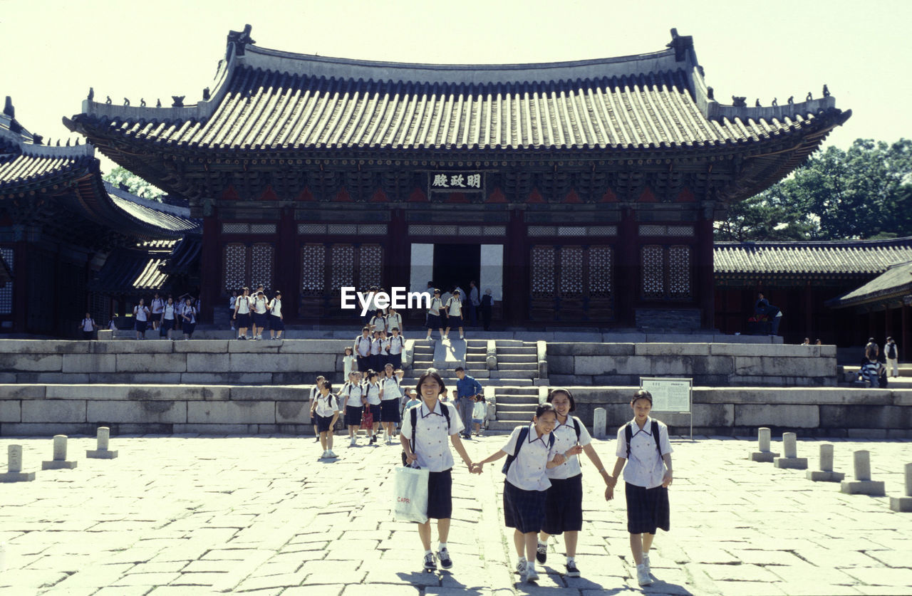 GROUP OF PEOPLE IN TEMPLE