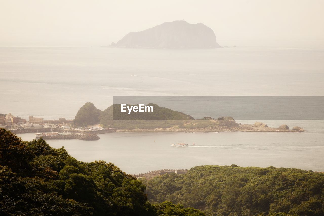 Scenic view of bay against sky