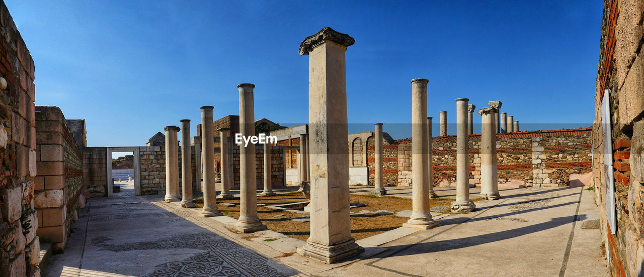 Old columns against blue sky