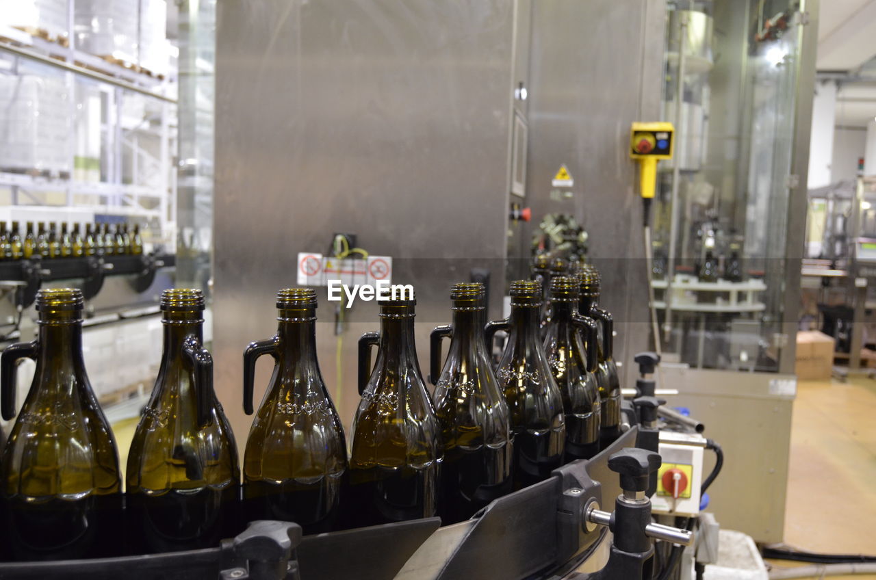 Panoramic shot of olive oil bottles on production line